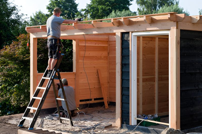 two men building a shed